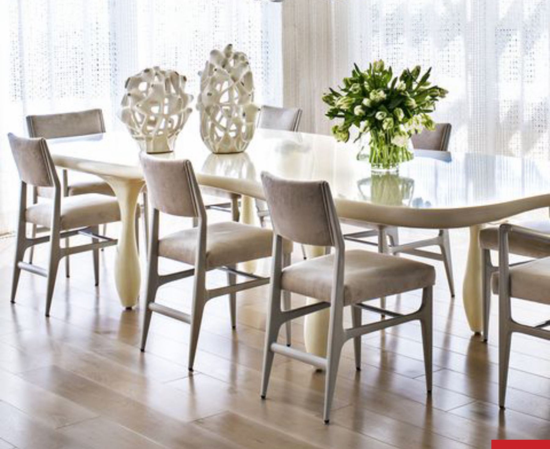 A bright dining room set with tulips